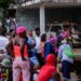 © PAHO/WHO/David Lorens Mentor People gather at a site for displaced people in Port-au-Prince, Haiti.