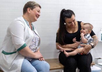 © UNICEF/Andriy Vashkiv Waiting for vaccination against influenza at a health centre in Kyiv's Shevchenkivskyi district.