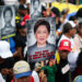 Maduro supporters hold signs with the image of Kamla Persad-Bissessar, prime minister of Trinidad and Tobago, during a demonstration against joint military exercises between the US and Trinidad and Tobago. Photograph: Jesús Vargas/picture-alliance/dpa/AP Images