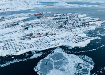 Houses covered by snow are seen on the coast of a sea inlet of Nuuk, Greenland, March 7, 2025. /VCG
