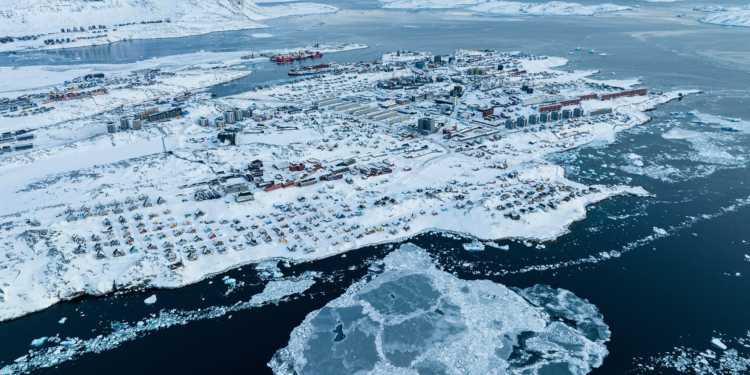 Houses covered by snow are seen on the coast of a sea inlet of Nuuk, Greenland, March 7, 2025. /VCG