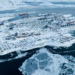 Houses covered by snow are seen on the coast of a sea inlet of Nuuk, Greenland, March 7, 2025. /VCG