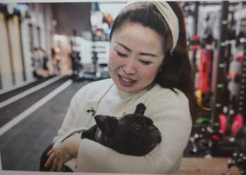 Angela He with her dog, Meiqiu, in Beijing on Wednesday. Fred Dufour / NBC News
