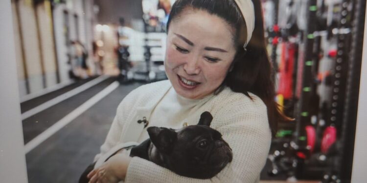 Angela He with her dog, Meiqiu, in Beijing on Wednesday. Fred Dufour / NBC News