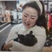 Angela He with her dog, Meiqiu, in Beijing on Wednesday. Fred Dufour / NBC News