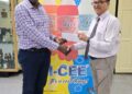Mr. Clayton McKenzie (L), I-CEE Brand Manager presents sponsorship cheque to Mr. Shiv Nandalall, PR Director of the Guyana Chess Federation (GCF) at the Banks DIH Thirst Park location.