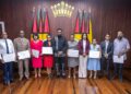 President Dr irfaan Ali (at centre), along with the seven members of the Teaching Service Commission (holding their instruments of appointment) and Minister of Education, Sonia Parag (fourth from right) and Minister of Public Service, Government Efficiency and Implementation (second from right) (Delano Williams photo- Guyana Chronicle)