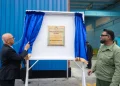 President Mohamed Irfaan Ali and Chairman of Banks DIH Clifford Reis unveil the commemorative plaque