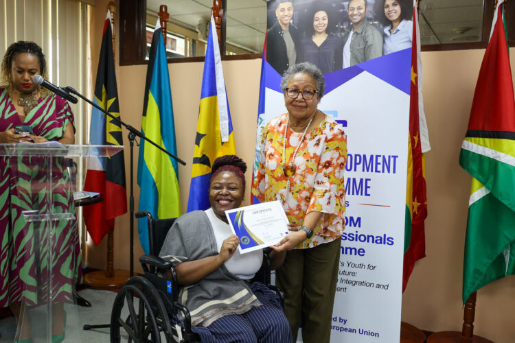 CARICOM Secretary-General Dr Barnett presenting a certificate to Yanique Mendez of Jamaica during the launch of the CARICOM Young Professional Network (CYPN) in October 2025