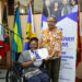 CARICOM Secretary-General Dr Barnett presenting a certificate to Yanique Mendez of Jamaica during the launch of the CARICOM Young Professional Network (CYPN) in October 2025