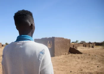 Dr. Mohamed Ibrahim, who asked for his face not to be shown, walk at the Rwanda refugee camp in Darfur, Sudan  Dec. 22. 2025 (AP Photo /Marwan Mohamed)
