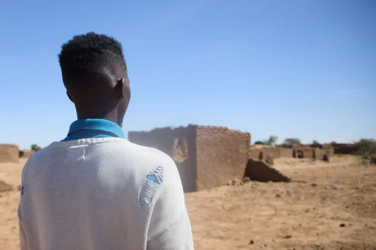 Dr. Mohamed Ibrahim, who asked for his face not to be shown, walk at the Rwanda refugee camp in Darfur, Sudan Dec. 22. 2025 (AP Photo /Marwan Mohamed)
