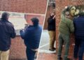 Workmen removing slavery exhibit at Philadelphia’s Independence National Historical Park