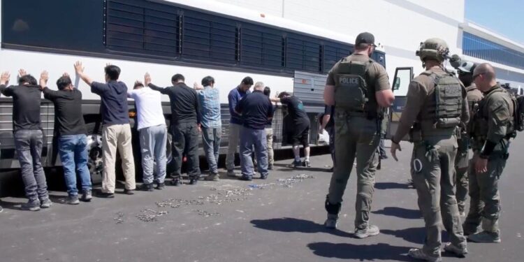 © Wikipedia/Corey Bullard/ICE ICE agents detain workers at vehicle manufacturing plant in Georgia, United States.