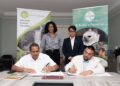 Director of the Guyana Tourism Authority, Kamrul Baksh and CEO of Iwokrama, Dane Gobin exchange signed copies in the presence of Minister of Tourism, Industry & Commerce, Hon. Susan Rodrigues and Iwokrama Special Projects Coordinator, AnneMarie Ford.