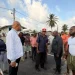 Minister of Public Works Bishop Juan Edghill engages B Field Sophia vendors on Tuesday