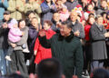 President Xi Jinping, also general secretary of the Communist Party of China Central Committee and chairman of the Central Military Commission, waves to the crowd while visiting the Longfusi commercial area in Dongcheng district of Beijing, Feb 10, 2026. [Photo/Xinhua]