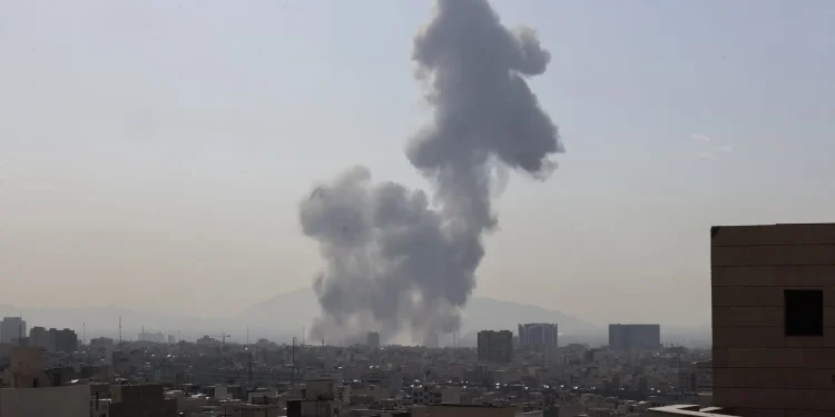 A plume of smoke rises following an explosion in Tehran on Saturday.Credit...Atta Kenare/Agence France-Presse — Getty Images