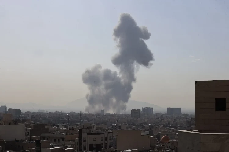 A plume of smoke rises following an explosion in Tehran on Saturday.Credit...Atta Kenare/Agence France-Presse — Getty Images