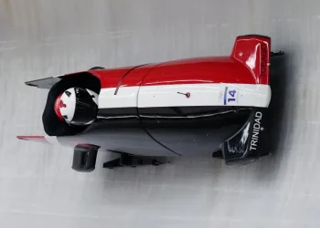 Axel Brown and De Aundre John of Trinidad and Tobago take part in a two-man bobsled training run Friday at the Milan-Cortina Olympics. (Richard Heathcote / Getty Images)