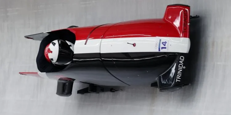 Axel Brown and De Aundre John of Trinidad and Tobago take part in a two-man bobsled training run Friday at the Milan-Cortina Olympics. (Richard Heathcote / Getty Images)
