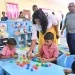 Minister of Education Sonia Parag engages a student at the new Mibicuri Nursery School