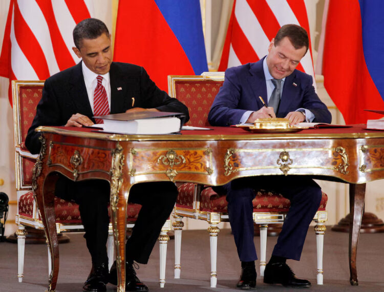 [2/2] Barack Obama (L) and Dmitry Medvedev, who were then the U.S. and Russian presidents, sign the new Strategic Arms Reduction Treaty (START II) at Prague Castle in Prague April 8, 2010. REUTERS/Jason Reed/File Photo Purchase Licensing Rights