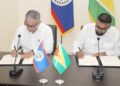 Following the formal addresses at the Belizean National Assembly for a special Joint Sitting of the House of Representatives and the Senate, President Dr. Irfaan Ali and Belize Prime Minister John Briceño inked several Memoranda of Understanding (Government of Belize Press Office photo)