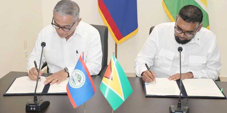 Following the formal addresses at the Belizean National Assembly for a special Joint Sitting of the House of Representatives and the Senate, President Dr. Irfaan Ali and Belize Prime Minister John Briceño inked several Memoranda of Understanding (Government of Belize Press Office photo)