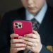 A 12-year-old school boy uses an iPhone in Bath, England in 2024. Matt Cardy / Getty Images