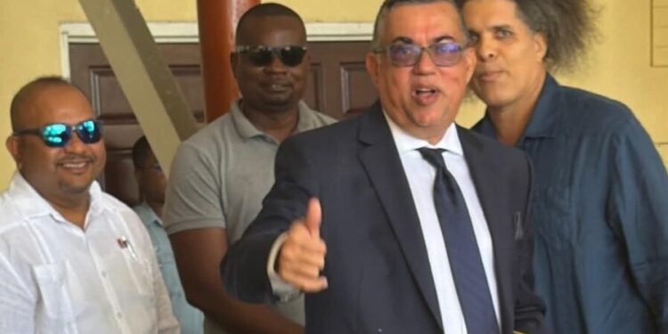 State Prosecutor Glen Hanoman (in tie) and Mikhail “Critic” Rodrigues,