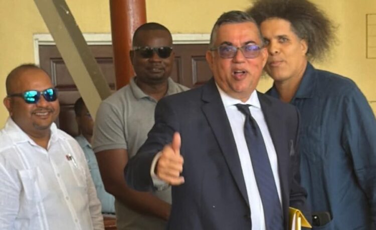 State Prosecutor Glen Hanoman (in tie) and Mikhail “Critic” Rodrigues,