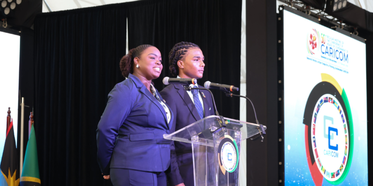 (L-R) St. Kitts and Nevis CARICOM Youth Ambassadors Siobhan Phipps-Harding and Aquanjé Robinson