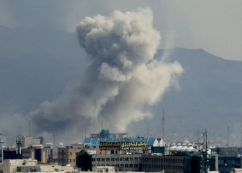 A plume of smoke acends after a military strike on the capital Tehran, Iran, March 2, 2026. /VCG