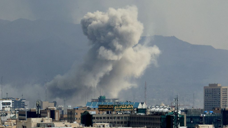 A plume of smoke acends after a military strike on the capital Tehran, Iran, March 2, 2026. /VCG