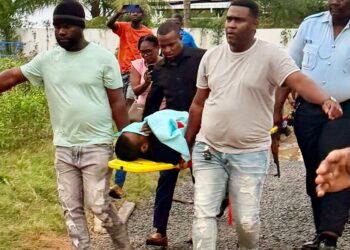 Christopher Ali being transported to the New Amsterdam Hospital after being brought out injured from the Berbice River