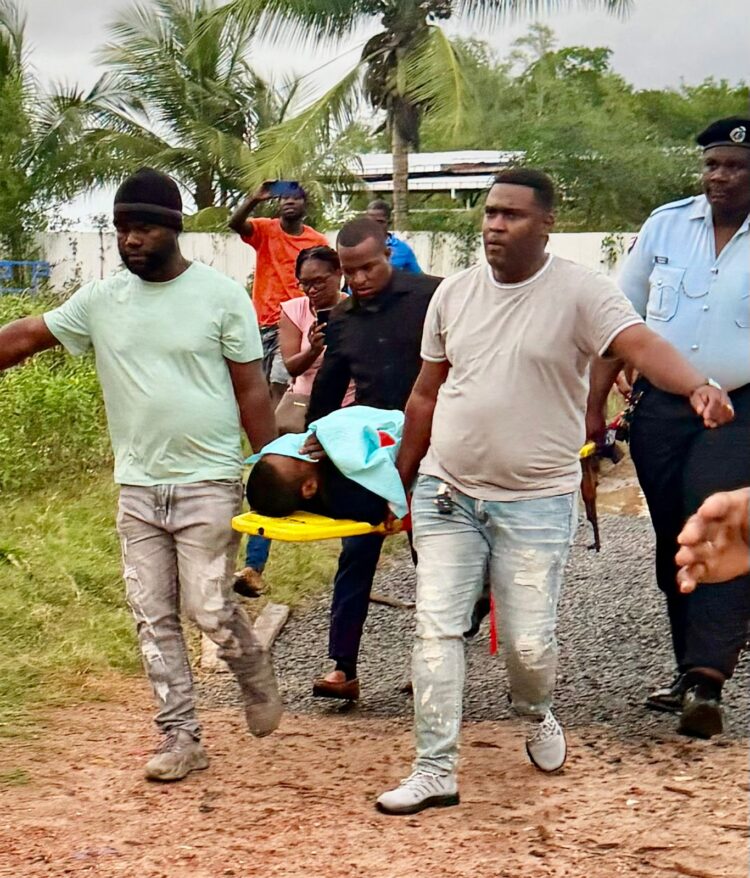 Christopher Ali being transported to the New Amsterdam Hospital after being brought out injured from the Berbice River