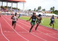 Athletes competing at the National Secondary Schools Track and Field Championships at the Leonora Track and Field Centre.