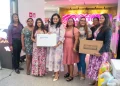 Minister of Human Services and Social Security, Dr Vindhya Persaud poses with some of the beneficiaries of the starter packs
