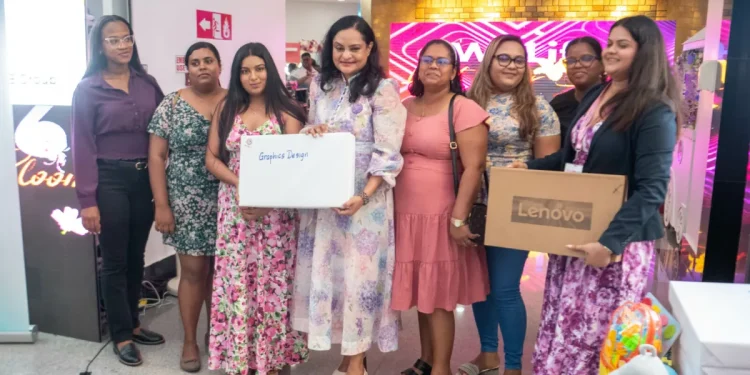 Minister of Human Services and Social Security, Dr Vindhya Persaud poses with some of the beneficiaries of the starter packs