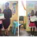 Jadon and Tiana DeCourte receiving their certificates from STEMGuyana