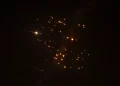 Rocket trails are seen in the sky amid a new barrage of Iranian missile attacks above the Israeli coastal city of Netanya, on March 18, 2026 [Jack Guez/AFP]