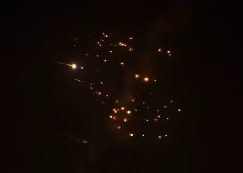 Rocket trails are seen in the sky amid a new barrage of Iranian missile attacks above the Israeli coastal city of Netanya, on March 18, 2026 [Jack Guez/AFP]