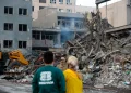 Residents inspect the aftermath of Israeli and US air strikes at Nilufar Square in the heart of the Iranian capital. [Fatemeh Bahrami/Anadolu]
