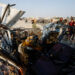 Palestinians inspect the site of an Israeli airstrike targeting a police vehicle in the central Gaza Strip, March 15, 2026. REUTERS/Mahmoud Issa Purchase Licensing Rights