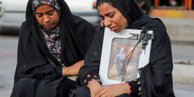 People mourn on the day of the funeral of the victims following a reported strike on a school in Minab, Iran, March 3, 2026. Amirhossein Khorgooei/ISNA/WANA (West Asia News Agency) via REUTERS Purchase Licensing Rights
