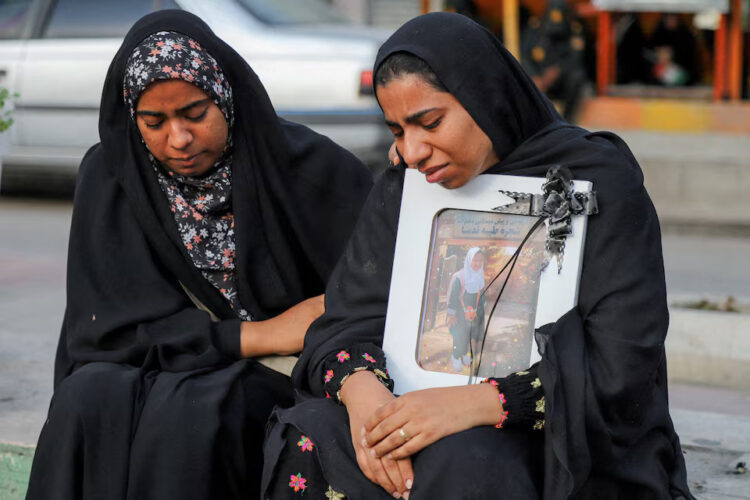 People mourn on the day of the funeral of the victims following a reported strike on a school in Minab, Iran, March 3, 2026. Amirhossein Khorgooei/ISNA/WANA (West Asia News Agency) via REUTERS Purchase Licensing Rights