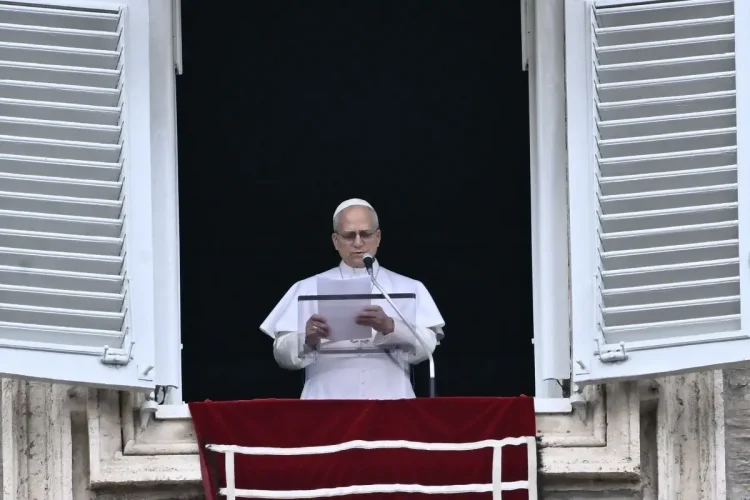 Pope Leo XIV gives a speech to the pilgrims gathered in St. Peter's Square during the Sunday Angelus prayer at the Vatican on March 15, 2026. (Photo by Filippo MONTEFORTE / AFP)