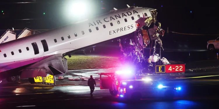 An Air Canada Express plane sits on the tarmac after it collided with a fire truck on the tarmac at LaGuardia Airport on March 23, 2026 in New York City. 
Spencer Platt/Getty Images