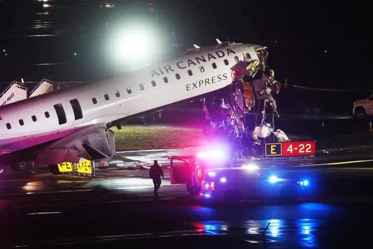 An Air Canada Express plane sits on the tarmac after it collided with a fire truck on the tarmac at LaGuardia Airport on March 23, 2026 in New York City. 
Spencer Platt/Getty Images